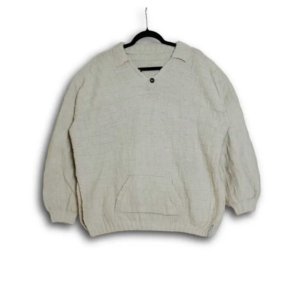 Beige jacket on a hanger against a white background