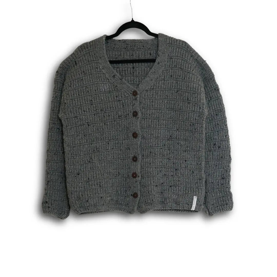 Gray textured cardigan on a hanger against a white background