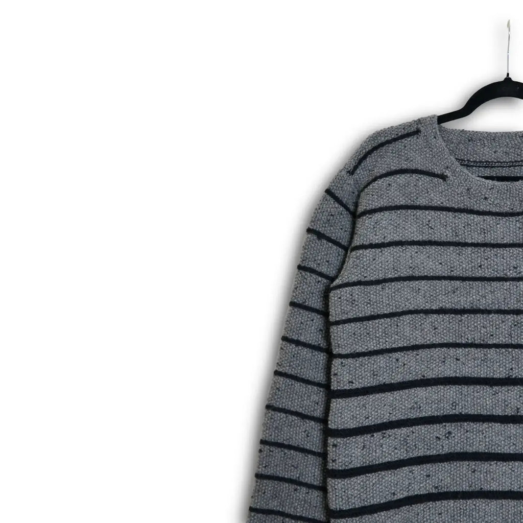 Hand-knitted gray Himalayan wool sweater with black stripes and subtle flecked texture, ethically made by indigenous Lahaul Valley artisans for sustainable luxury fashion brands.