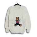 Hand-knitted cream Himalayan wool sweater with custom intarsia bear motif, ethically made by indigenous Lahaul Valley artisans for sustainable boutique fashion brands.