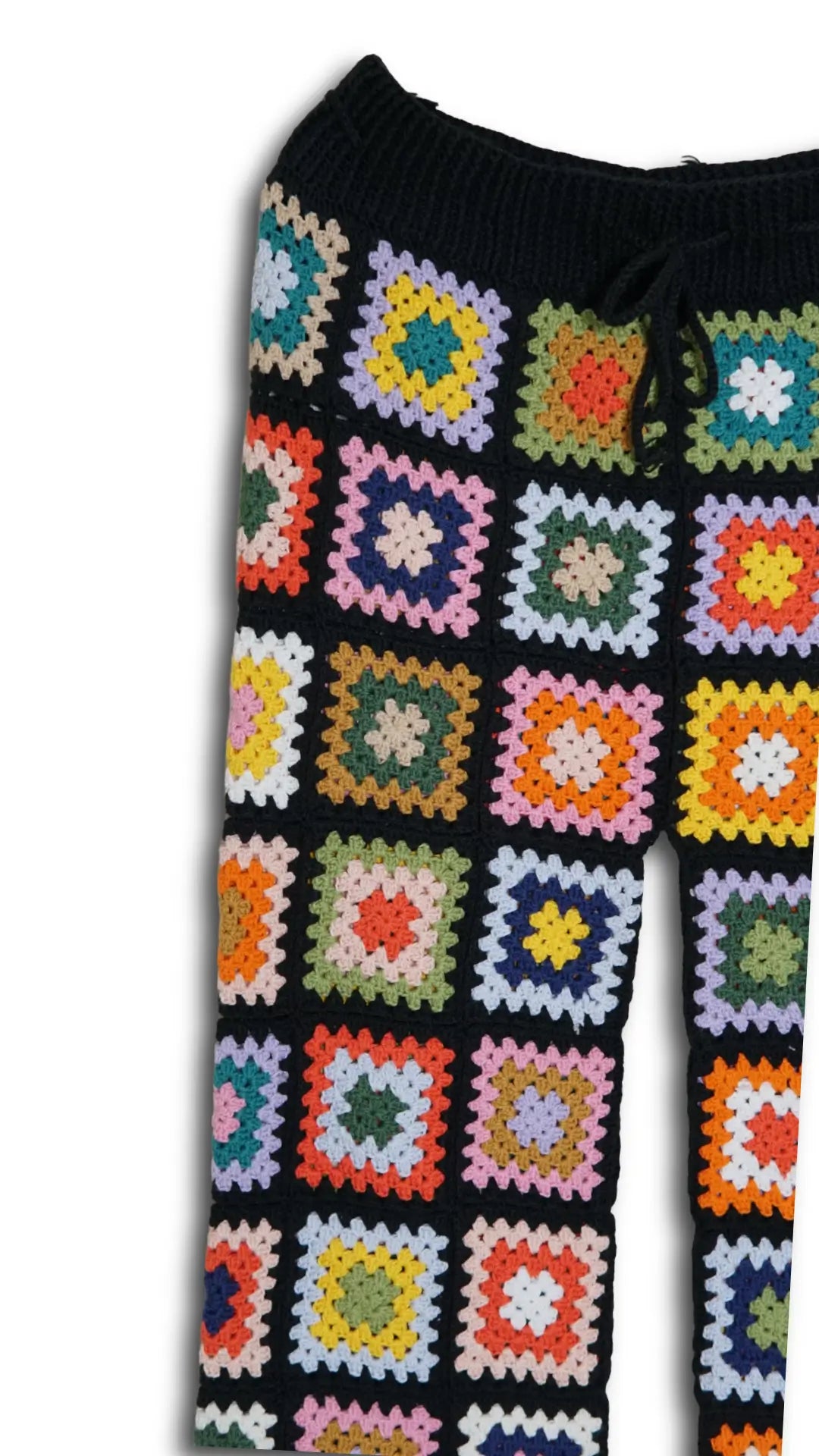 Colorful crochet patterned leg warmers on a black background