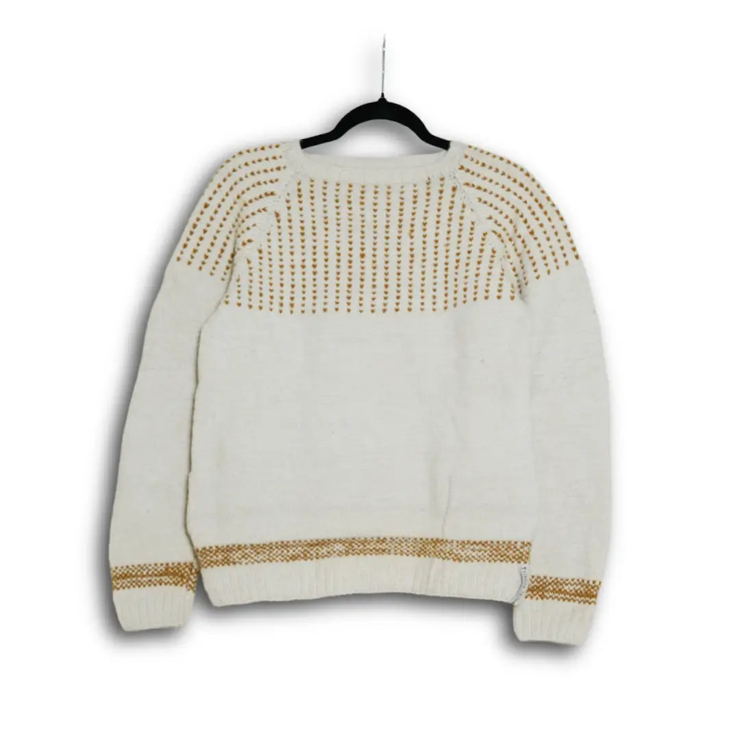 Hand-knitted cream Himalayan wool sweater with traditional gold-patterned yoke, ethically made by indigenous Lahaul Valley artisans for sustainable luxury fashion brands