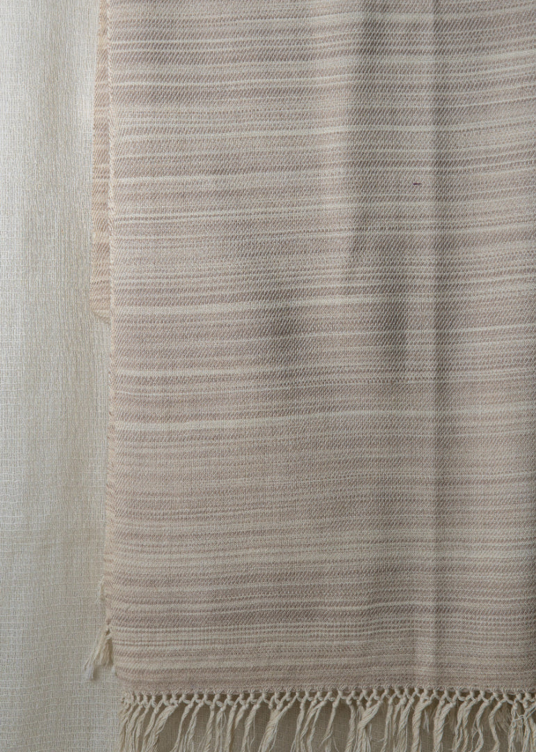 Premium ultra-soft 100% pure Himalayan white sheep wool fabric, hand-loomed with delicate fringe details by indigenous Lahaul Valley artisans for luxury B2B fashion.